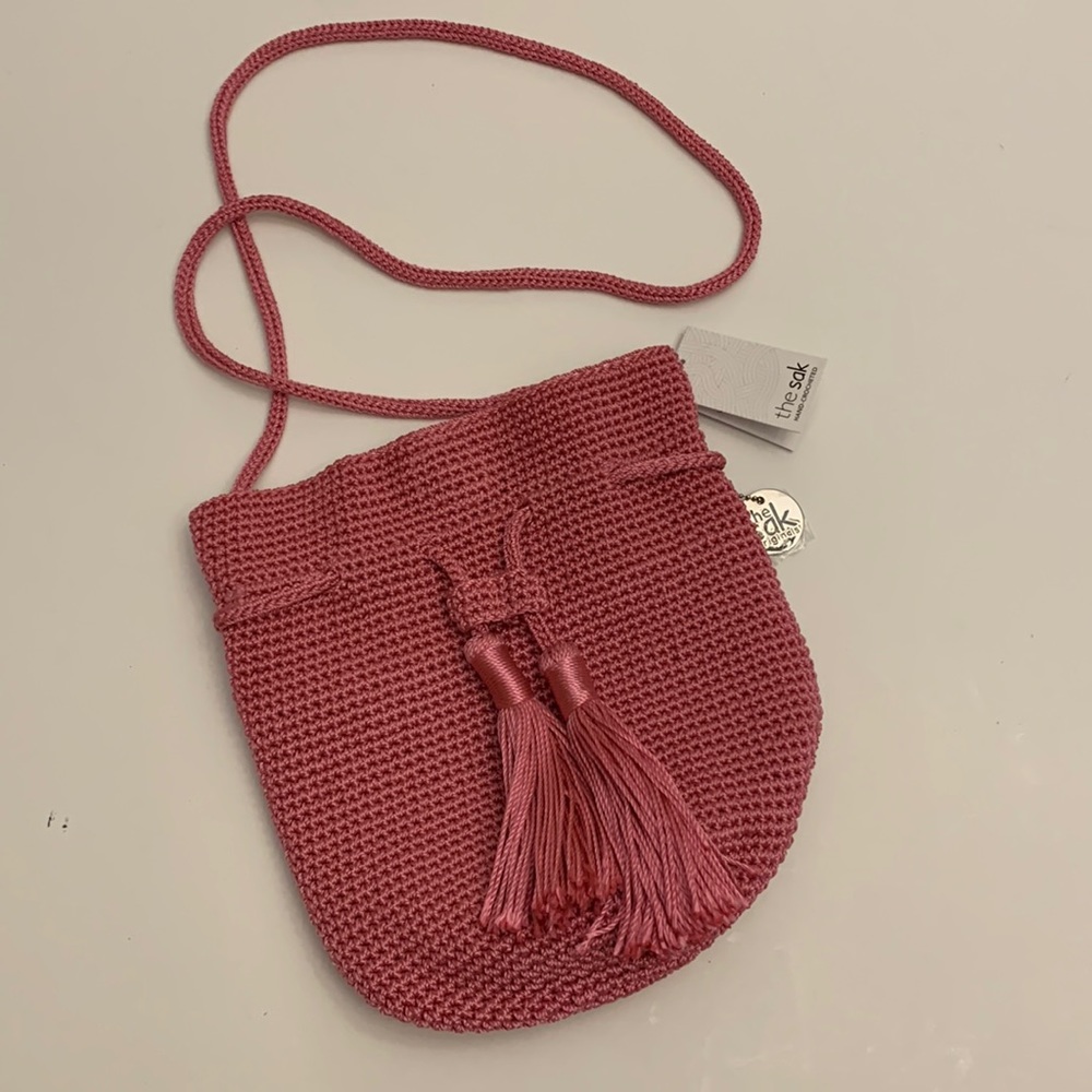 the sak Pink Crochet Tassel Crossbody Bag